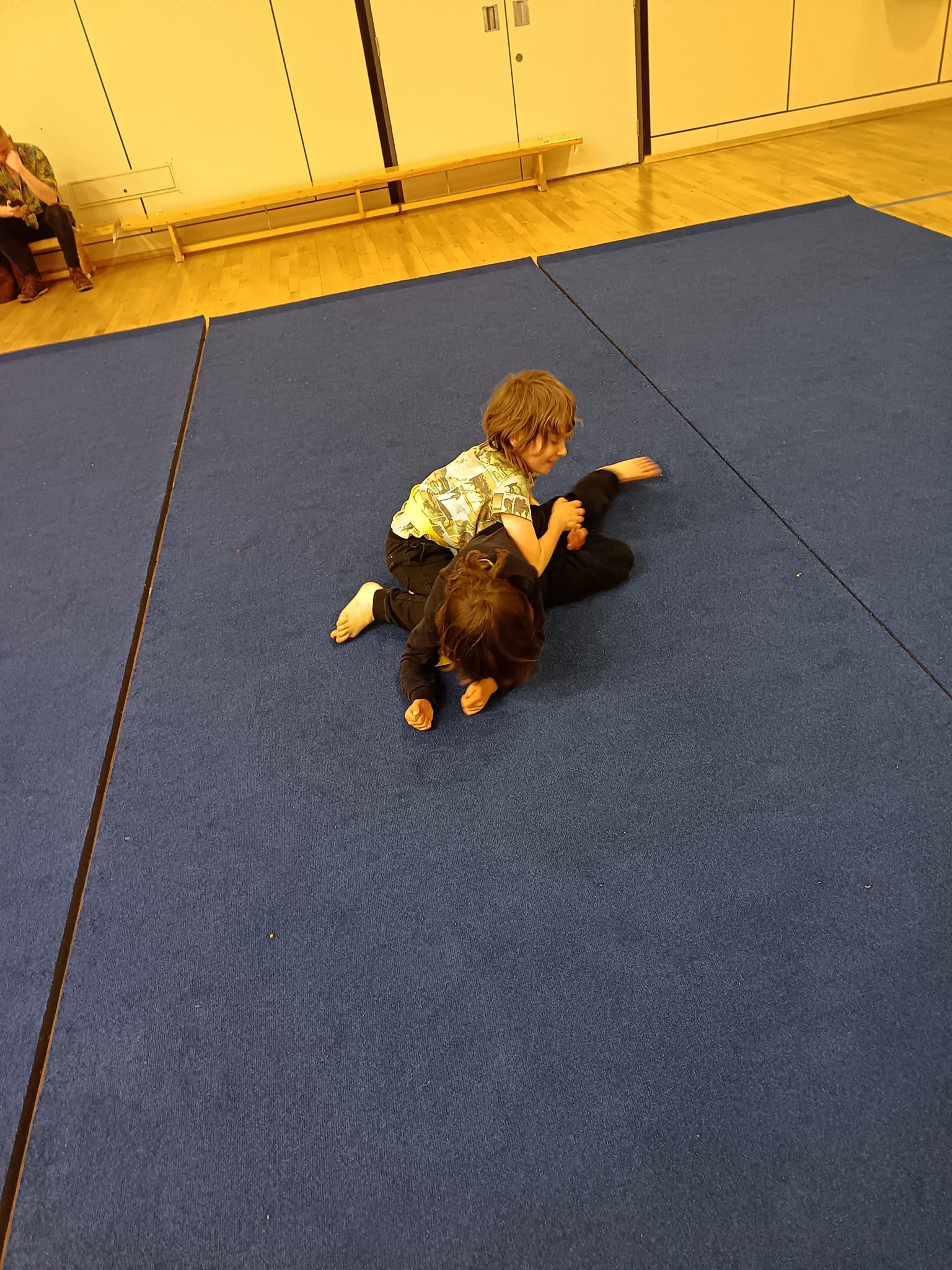 Two children practicing martial arts on a blue mat in Redcar. Children's martial arts Redcar.
